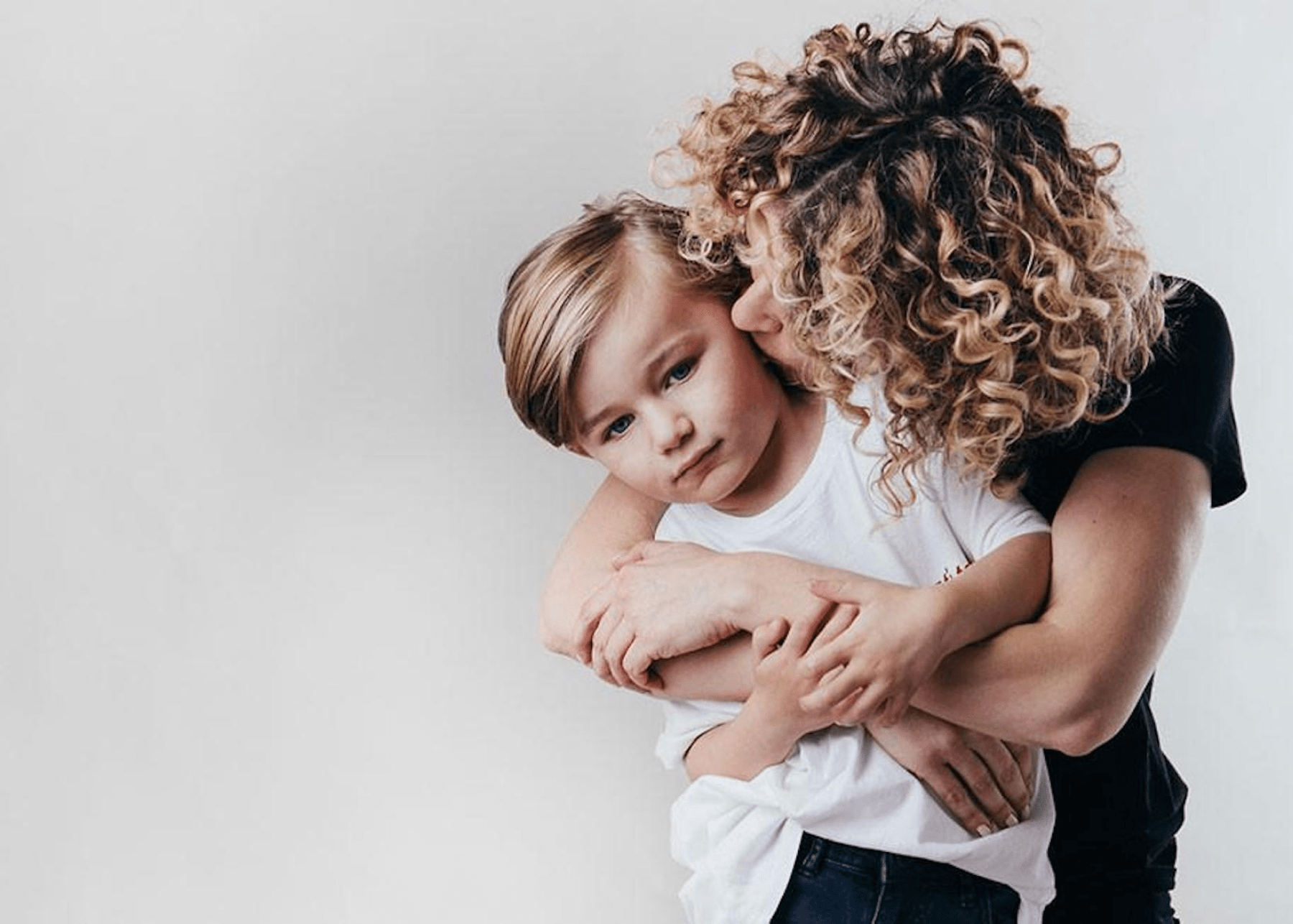 mom kissing her son