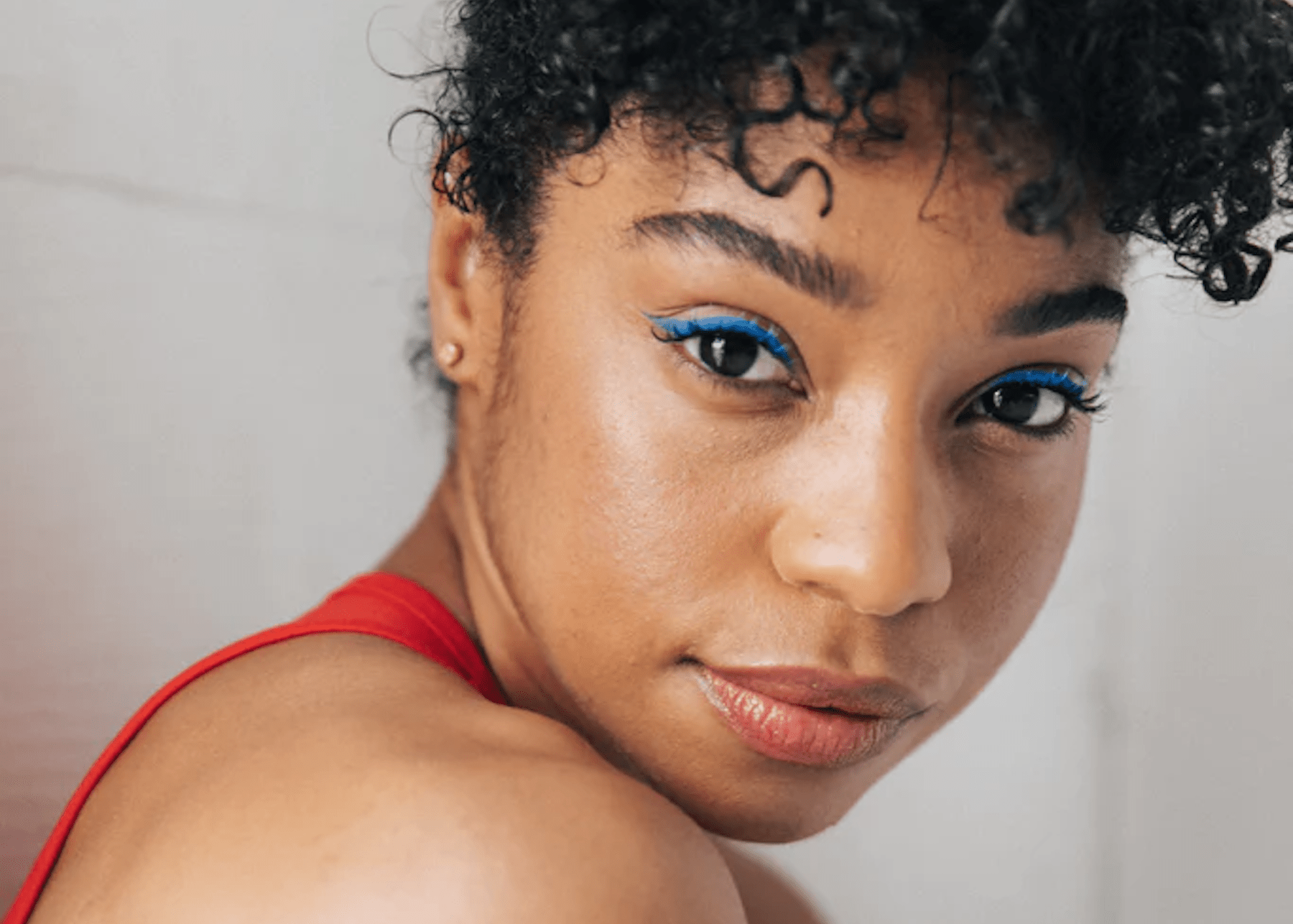 close up of Natasha with blue eye shadow