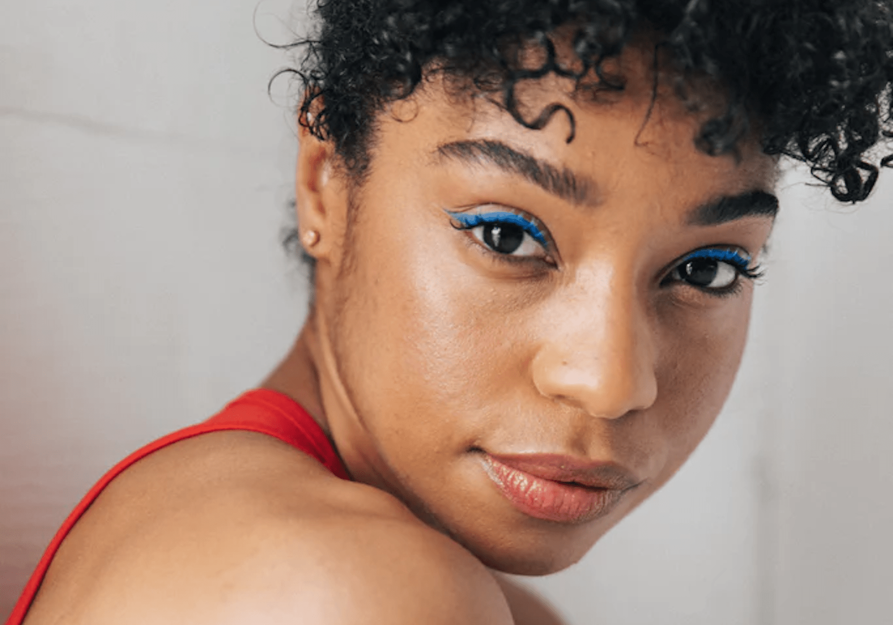 close up of Natasha with blue eye shadow