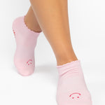 Women wearing brown beige grip socks with white smiley face for Pilates, Barre, Yoga, and beyond. 