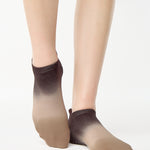 Women wearing a dark brown, light brown, and tan ombre full foot grip sock made for pilates, yoga, barre, and beyond.