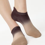 Women wearing a dark brown, light brown, and tan ombre full foot grip sock made for pilates, yoga, barre, and beyond.