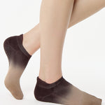 Women wearing a dark brown, light brown, and tan ombre full foot grip sock made for pilates, yoga, barre, and beyond.