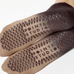 Women wearing a dark brown, light brown, and tan ombre full foot grip sock made for pilates, yoga, barre, and beyond.