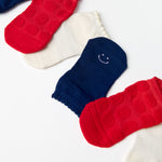A festive americana Pilates Grip Sock Gift Pack  that includes a red, white, and blue pair of full foot grip socks. Made for pilates, barre, yoga, and beyond. 