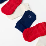 A festive americana Pilates Grip Sock Gift Pack  that includes a red, white, and blue pair of full foot grip socks. Made for pilates, barre, yoga, and beyond. 