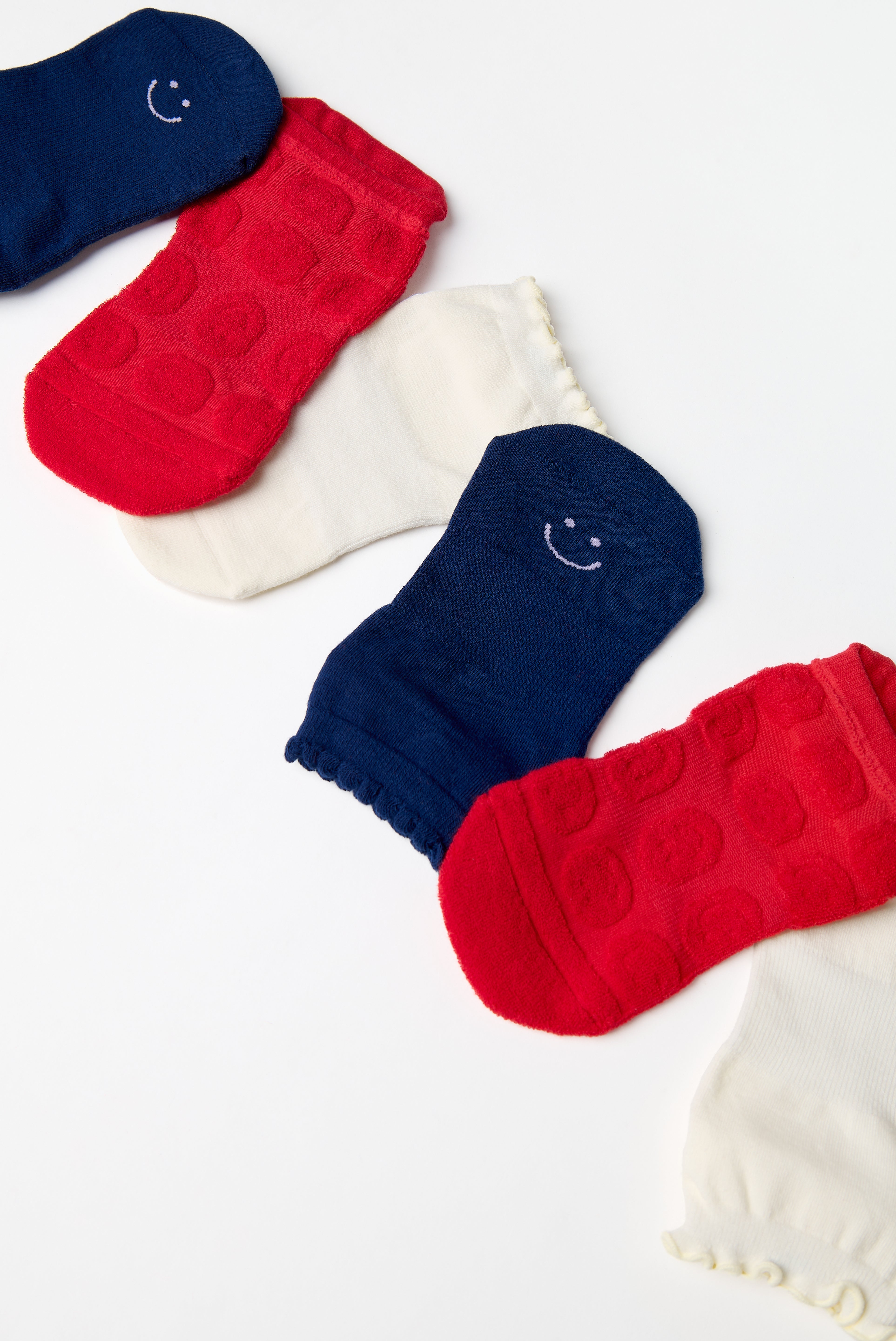 A festive americana Pilates Grip Sock Gift Pack  that includes a red, white, and blue pair of full foot grip socks. Made for pilates, barre, yoga, and beyond. 