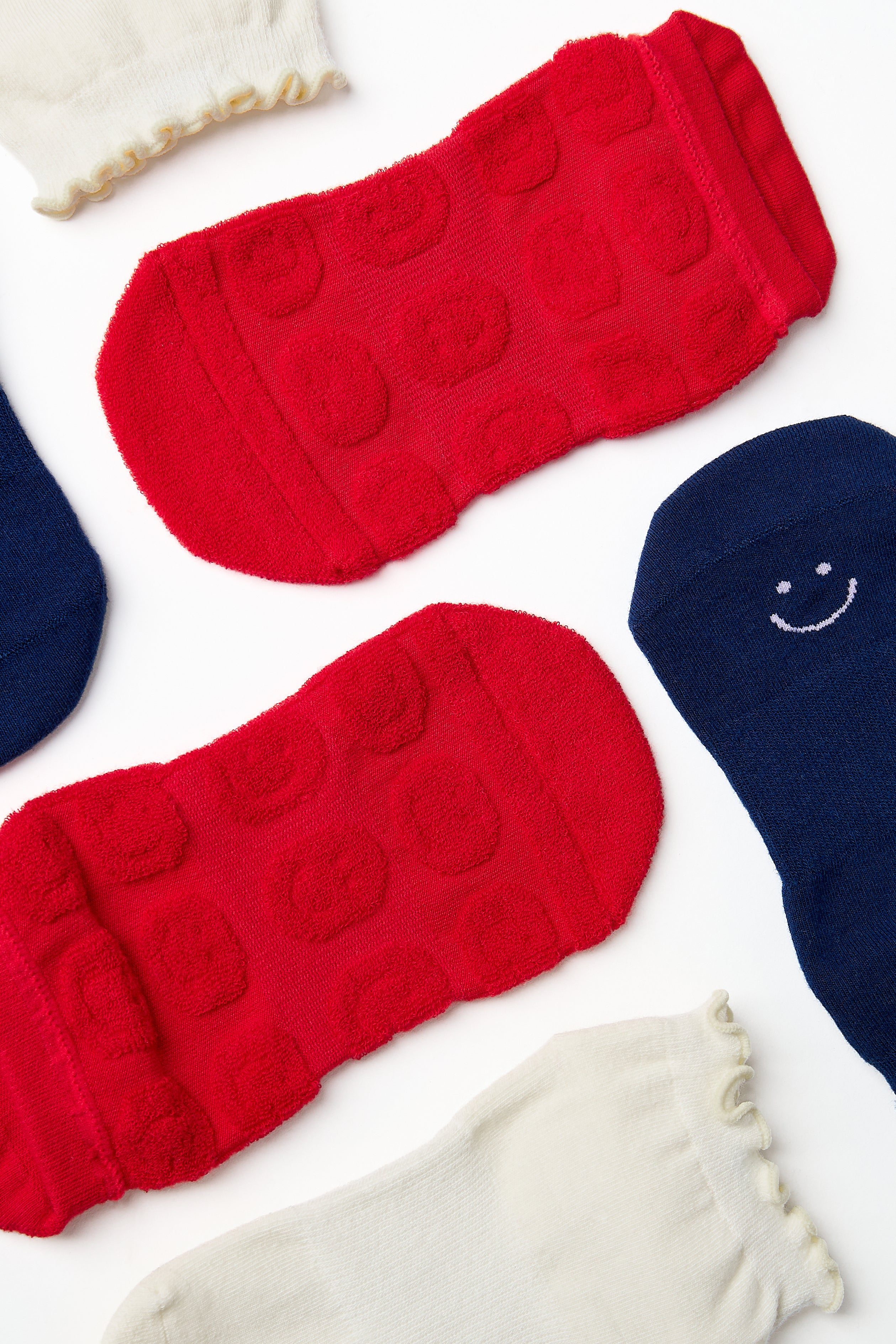 A festive americana Pilates Grip Sock Gift Pack  that includes a red, white, and blue pair of full foot grip socks. Made for pilates, barre, yoga, and beyond. 