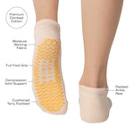 Women wearing an off white full foot grip sock with bananas string of red hearts , made for pilates, barre, yoga, and beyond with a list of product listing.