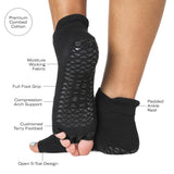 Women wearing a solid black full foot 5 toeless grip socks, made for pilates, barre, yoga, and beyond with the product features listed.