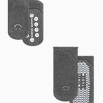 A 2 grip sock pack of charcoal grey full foot happy face styles one for a kid ages 4-7 and one matching for an adult. 