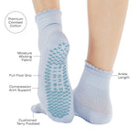 Women wearing light blue ankle grip socks with blue happy face for Pilates, Barre, Yoga, and beyond and a list of features.
