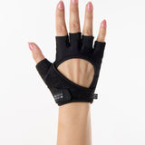 Woman wearing black Pilates grip gloves