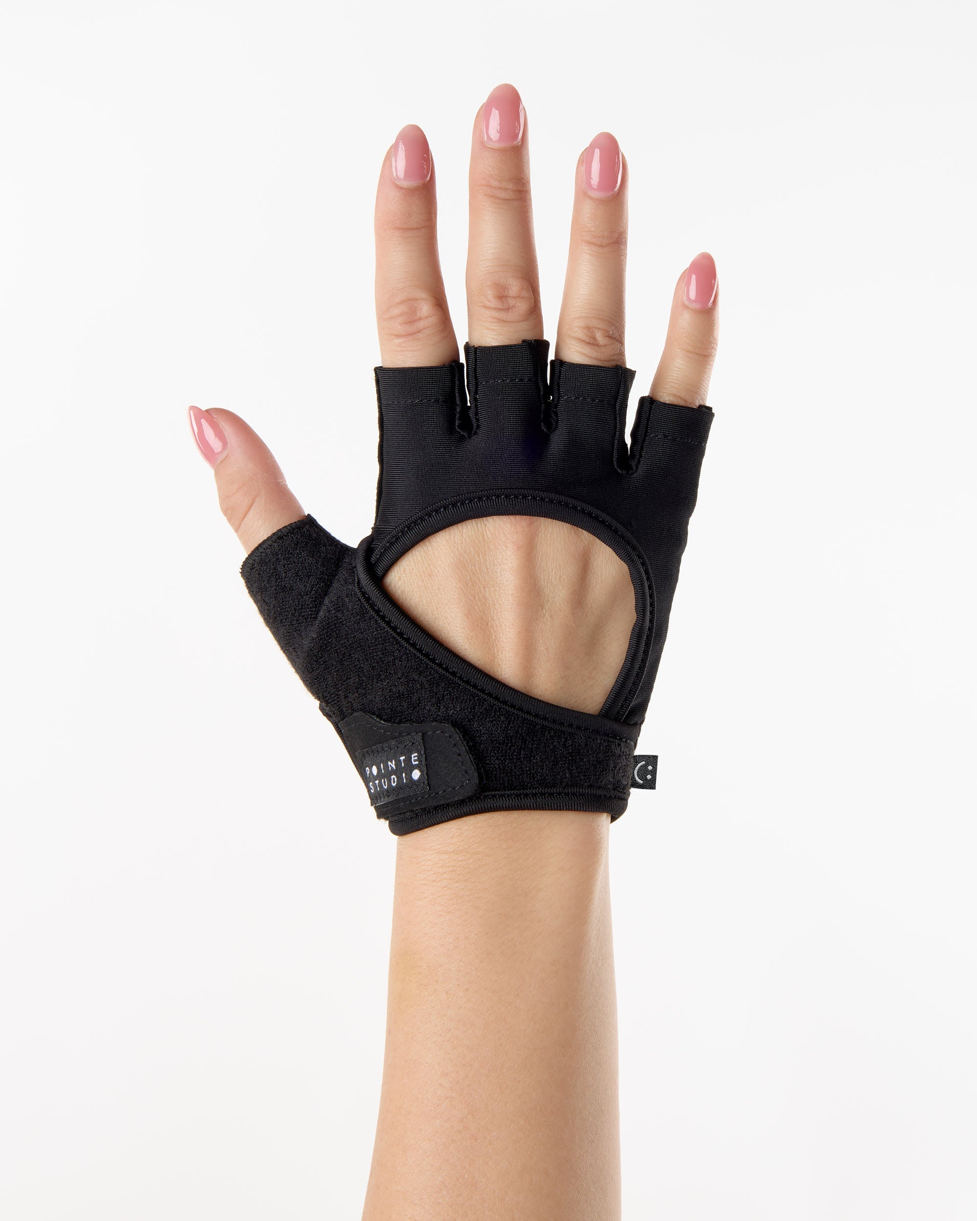 Woman wearing black Pilates grip gloves