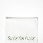A small white water resistant pouch for pilates, barre, and yoga grip socks. It says "sanity not vanity" on the pouch.