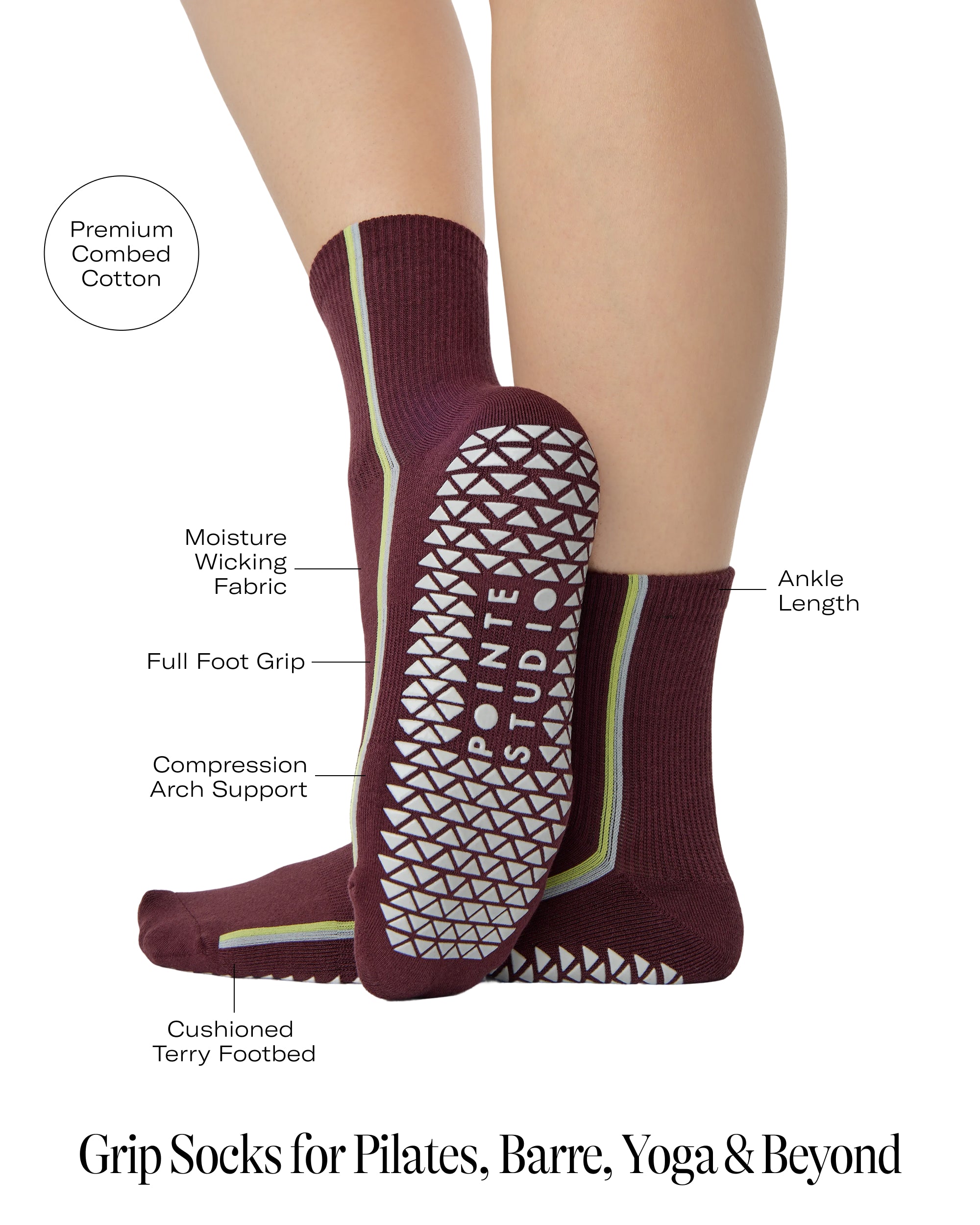 Woman wearing a brownish cherry red solid color ankle grip sock with two green and blue bold racing stripes on the side, made for pilates, barre, yoga, and beyond. With all the product features listed.