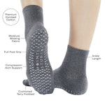 Women wearing a solid charcoal gray ankle grip sock made for Pilates, Barre, Yoga, and beyond with features listed.