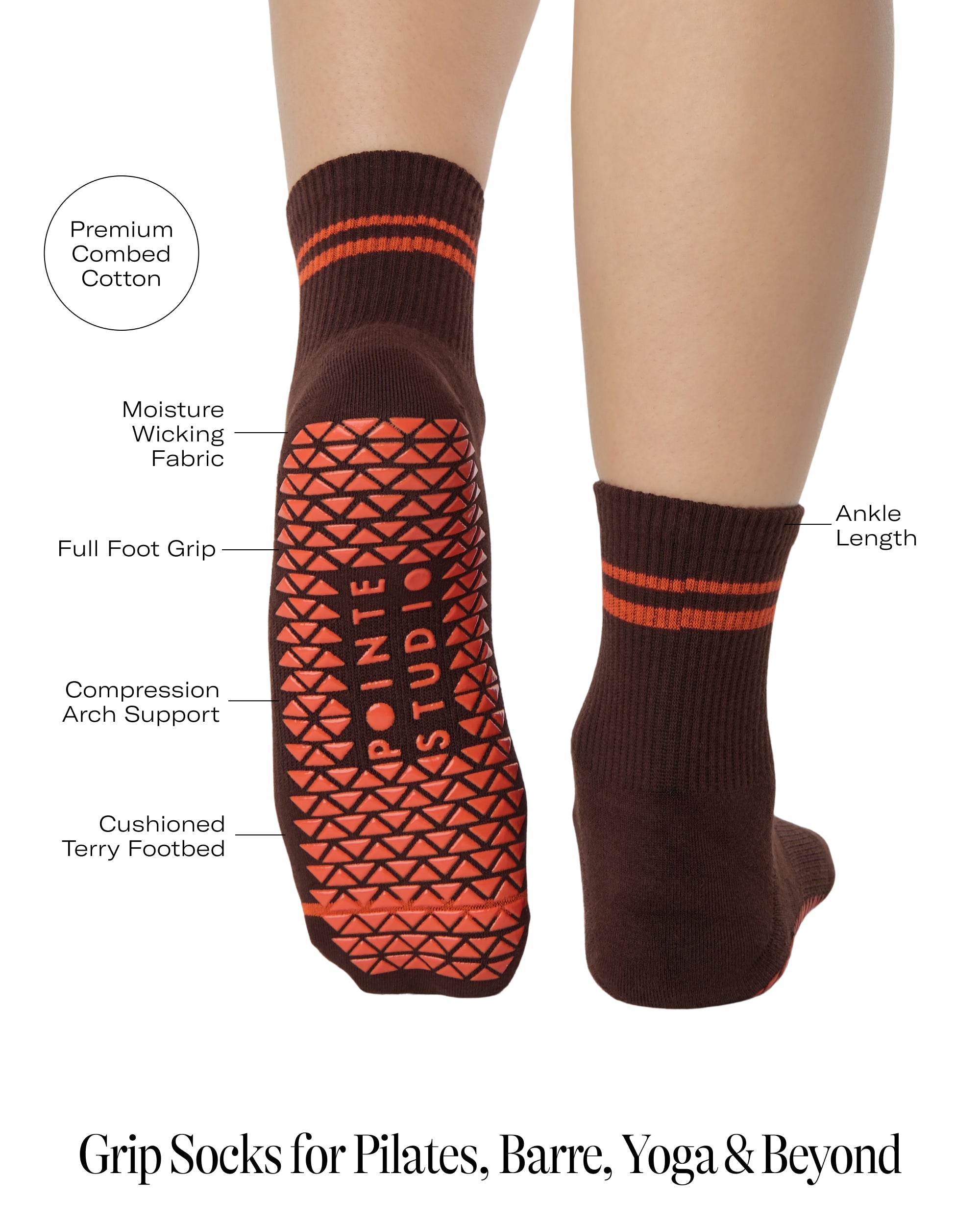 Woman wearing a solid chocolate brown ankle grip sock with orange stripes on the toes and top ankle cuff made for Pilates, Barre, Yoga, and beyond. With all product features.