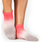 Women wearing a red and dusty purple ombre full foot grip sock made for pilates, yoga, barre, and beyond.